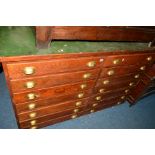 AN EARLY 20TH CENTURY OAK SIDE BY SIDE CHEST OF FOURTEEN DRAWERS, with brass cupped handles and a