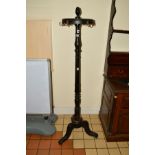 AN EARLY 20TH CENTURY EBONISED SWIVEL TOP COAT STAND, on tripod legs, stamped Stockman, Paris,