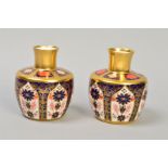 A PAIR OF ROYAL CROWN DERBY OLD IMARI VASES, solid gold band '1128' pattern, approximate height 10.