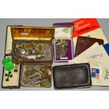 A SMALL COLLECTION OF MILITARIA, including two tins of cap badges and buttons, a cased Military
