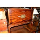 A REPRODUCTION MAHOGANY TWO DOOR DRINKS CABINET on cabriole legs, width 75.5cm x depth 36cm x height