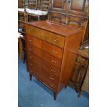 A TALL 1960'S/70'S TEAK CHEST OF SIX DRAWERS with brassed handles on four tapering legs, width 76.