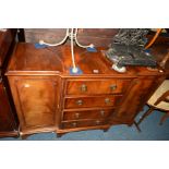 A REPRODUCTION MAHOGANY SIDEBOARD with four central drawers, width 119cm x depth 41cm x height 82cm