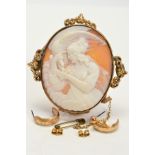 A GOLD SHELL CAMEO BROOCH depicting Leda and the Swan (Zeus in disguise) or Hebe and the Eagle (also