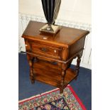 A TITCHMARSH AND GOODWIN OAK CANTED HALL TABLE with a single drawer, on shaped uprights adjoined