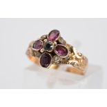 A MID VICTORIAN GOLD AMETHYST AND SPLIT PEARL RING, designed as four oval amethysts in a flower