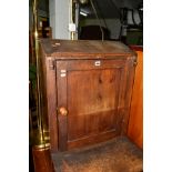 AN EARLY 20TH CENTURY STAINED PINE PRAYER STAND with a single cupboard door