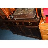 A 19TH CENTURY AND LATER OAK SIDEBOARD with three short drawers and double cupboards, width 136cm
