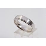 A MODERN PLATINUM WEDDING BAND, flat cross section with outer fine line edge, measuring