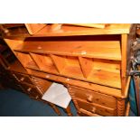 A PINE DRESSING TABLE with six drawers, width 151cm, stool and a pine coffee table (3)