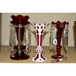 THREE LATE 19TH CENTURY GLASS TABLE LUSTRES, to include a red and white overlay example, missing