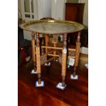 AN EDWARDIAN MAHOGANY AND PARQUETRY INLAID FOLDING BRASS TOPPED OCCASIONAL TABLE, the brass tray