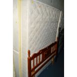 A 4' 6'' DIVAN BED AND NON MATCHING MATTRESS with a pine headboard