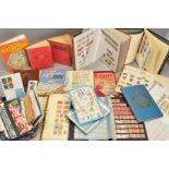 AN ACCUMULATION OF STAMPS, covers in albums and loose