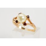 A 9CT GOLD PEARL AND GARNET RING, the central pearl within a four garnet surround, to the bifurcated