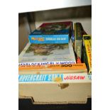 A QUANTITY OF VINTAGE BOXED WOODEN JIGSAWS, majority on a railway theme, contents not checked,