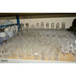 A QUANTITY OF CUT GLASS ETC, to include ten decanters of varying styles, red and white wine glasses,