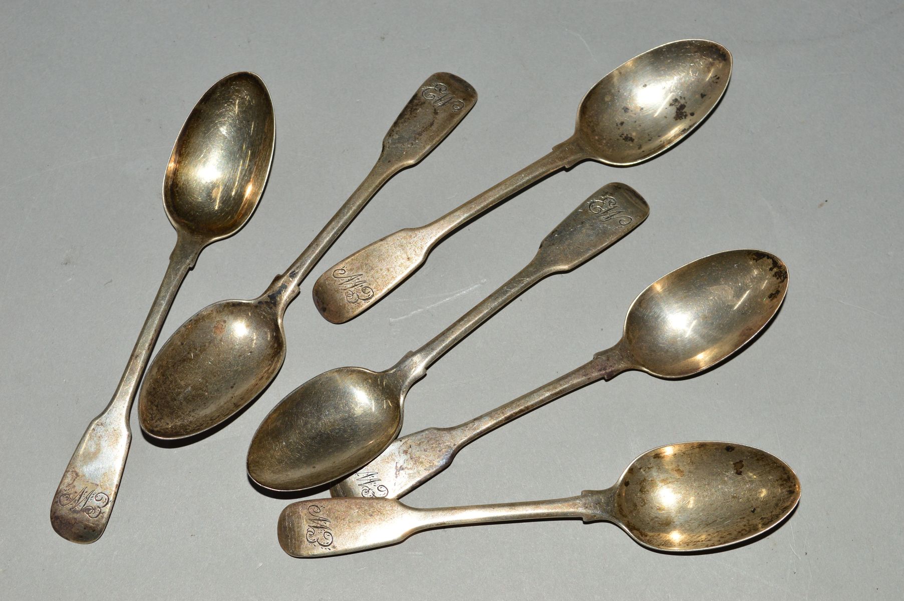 A SET OF SIX VICTORIAN SILVER FIDDLE PATTERN TEASPOONS, engraved initials, maker SH, London 1864,