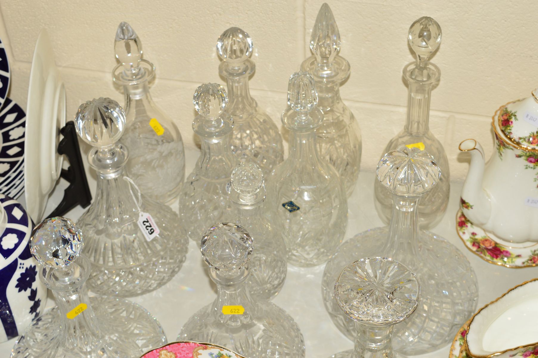 TWELVE VARIOUS CUT GLASS DECANTERS to include ships decanters, Brierley crystal, Czechoslovakia,