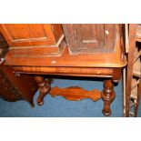 A VICTORIAN WALNUT WASHSTAND with a raised back and sides on baluster uprights united by a shaped