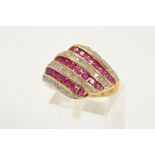 A MODERN RUBY AND DIAMOND DRESS RING, comprised rubies and diamonds grain and channel set, ring size