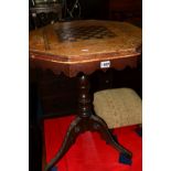 AN EDWARDIAN ROSEWOOD, WALNUT AND MAHOGANY OCTAGONAL CHESS TABLE, on a tripod base (losses)
