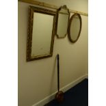 THREE VARIOUS GILT FRAMED WALL MIRRORS, modern cuckoo clock and a brass warming pan (5)