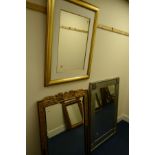 A MODERN GILT FRAMED BEVELLED EDGE WALL MIRROR, 76.5cm x 111cm together with a silvered wall