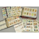 A COLLECTION OF APPROXIMATELY ONE THOUSAND EIGHT HUNDRED AND EIGHTY FIVE CIGARETTE CARDS, in 43 sets