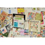AN ACCULUMATION OF STAMPS, in Juvenile albums and loose