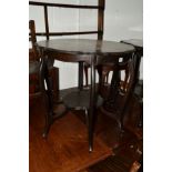 AN EDWARDIAN EBONISED OCCASIONAL TABLE