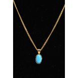 A MODERN 18CT GOLD SINGLE STONE OVAL TURQUOISE PENDANT, measuring approximately 10.6mm in length,