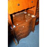 A REPRODUCTION MAHOGANY AND BANDED SERPENTINE CHEST OF FOUR LONG GRADUATED DRAWERS, with a