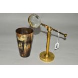 AN EARLY 20TH CENTURY BRASS TABLE TOP MAGNIFIER ON A TELESCOPIC STAND, adjustable angle, together