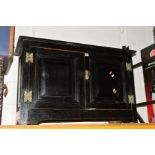 AN OAK BLACK PAINTED TWO DOOR CUPBOARD