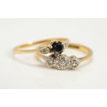 TWO DIAMOND RINGS to include a three stone diamond ring, ring size N1/2, a 9ct gold sapphire and