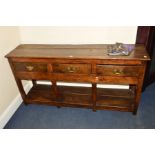 A 20TH CENTURY OAK DRESSER BASE, incorporating older timbers, three drawers with brass swan neck