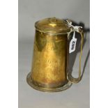 A 19TH CENTURY BRASS TANKARD OF CYLINDRICAL FORM, domed hinged cover (broken) flattened base, the