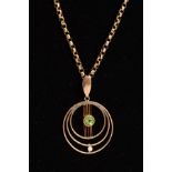 AN EARLY 20TH CENTURY PERIDOT AND SEED PEARL CIRCULAR PENDANT, open work design, together with a