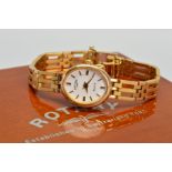 A 9CT GOLD LADY'S ROTARY WATCH, oval dial with gold baton hour markers and hands, quartz movement,