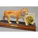 A FRANKLIN MINT PORCELAIN FIGURE OF A BENGAL TIGER, entitled 'On the Prowl', on plinth,