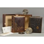 A LATE 19TH/EARLY 20TH CENTURY MUSICAL PHOTOGRAPH ALBUM FITTED WITH A JUNGHENS MOVEMENT, the