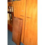 A 1960'S WALNUT AND TEAK THREE PIECE BEDROOM SUITE, comprising a double door wardrobe on four