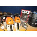 TWO STIHL STYLE CHAINSAW BODIES (spares or repairs) with a blade, a Clarke Devil 60003 heater and