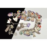 TWO SILVER CHARM BRACELETS to include a curb link charm bracelet full of assorted enamelled shield