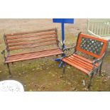 A BROWN STAINED TEAK SLATTED WOODEN BENCH with black painted cast iron ends, together with a similar