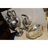 A VICTORIAN SILVER PLATED TWIN HANDLED SAMOVAR OF OVOID FORM, on a circular base with four bun feet,