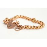 AN EARLY 20TH CENTURY ROSE GOLD CHARM BRACELET, uniform plain hollow curb links fitted to a