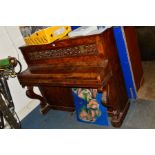 A VICTORIAN WALNUT ROBERT COCKS AND COMPANY, LONDON UPRIGHT PIANO, with fretwork panel, flanked by