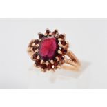 A LATE 20TH CENTURY GARNET OVAL CLUSTER RING, ring size P, hallmarked 9ct gold, approximate gross